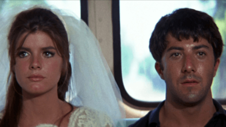 Katharine Ross and Dustin Hoffman as Elaine in her wedding dress and Benjamin at the end of the Graduate