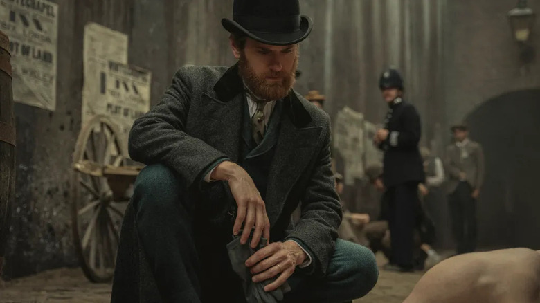 Alfred Hillinghead (Kyle Soller) examines a corpse in an alley in Bodies