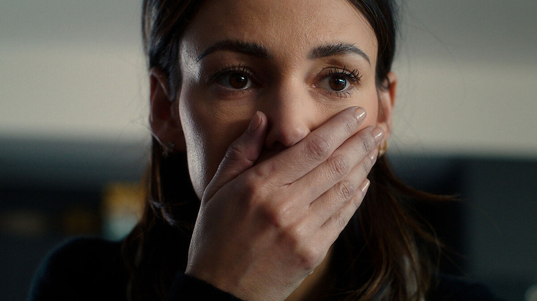 Maya Burkett (Michelle Keegan) covers her mouth in surprise in Fool Me Once