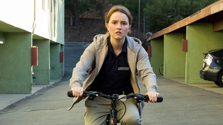 Marie Adler (Kaitlyn Dever) bikes through a parking garage in Unbelievable