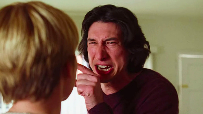 Adam Driver as Charlie yelling and pointing figure at Scarlett Johansson as Nicole (face not pictured) in Marriage Story