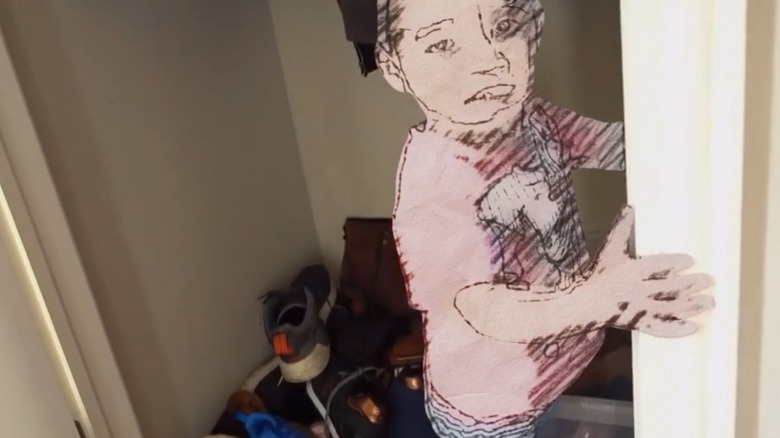 A drawn-over child standing in a closet, from An Update On Our Family
