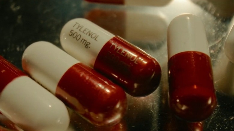 A closeup of four red and white 500mg Tylenol pills, from Cold Case: The Tylenol Murders