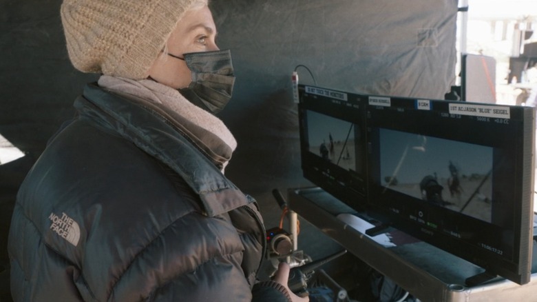 Halyna Hutchins sitting behind monitors on the set of Rust, from Last Take: Rust and the Story of Halyna