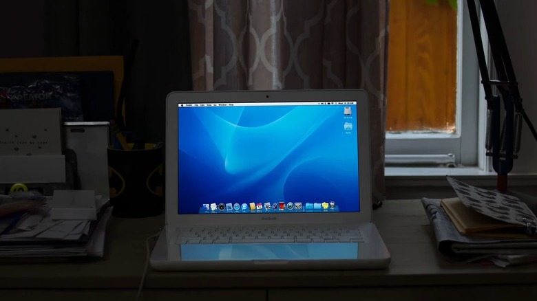 A Macbook sitting on a kid's desk at home, from Spy High