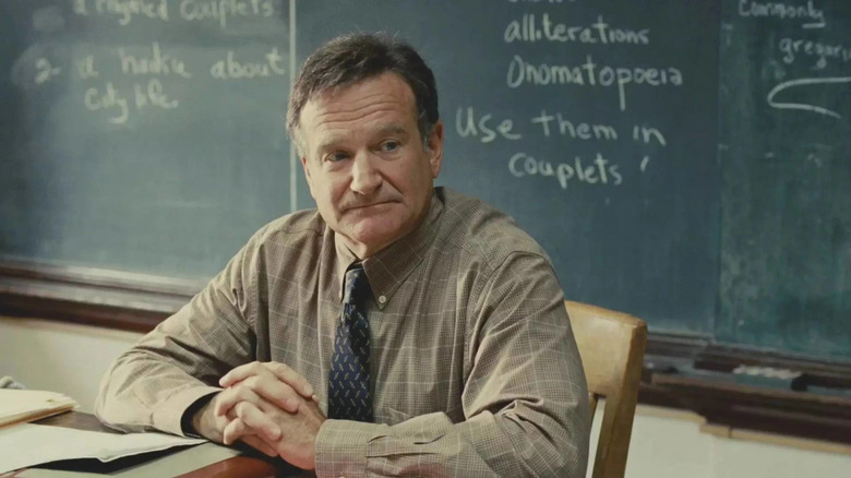 Lance Clayton (Robin Williams) sits at his classroom desk in World's Greatest Dad