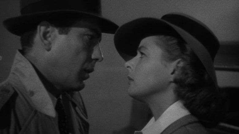 Humphrey Bogart as Rick Blaine and Ingrid Bergman as Ilsa Lund looking at each other in Casablanca