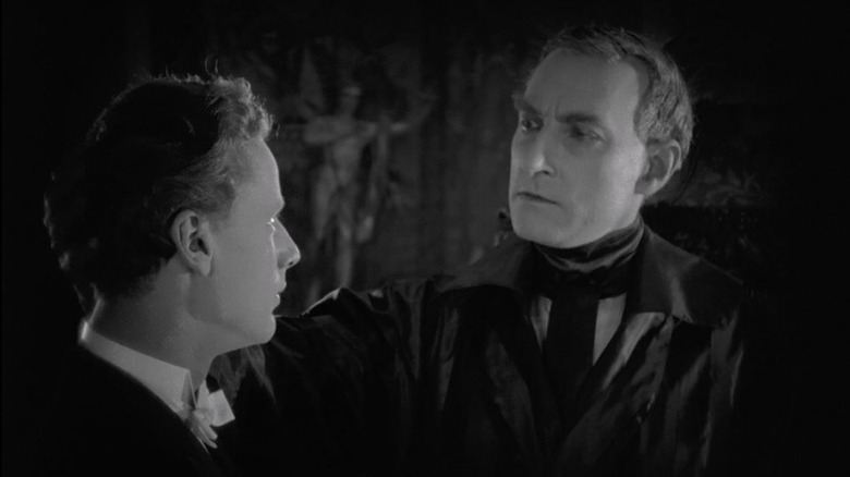Benjamin Christensen as Claude Zoret touching the shoulder of Walter Slezak as Eugène Michael in Michael