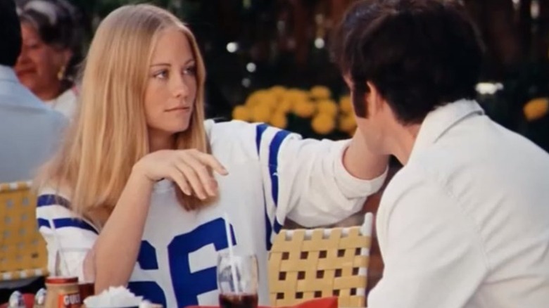 Cybill Shepherd as Kelly Corcoran touching the face of Charles Grodin as Lenny Cantrow in The Heartbreak Kid