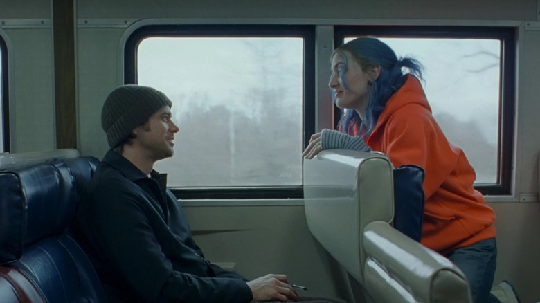 Kate Winslet as Clementine Kruczynski talks to Jim Carrey as Joel Barish on a train in Eternal Sunshine of the Spotless Mind