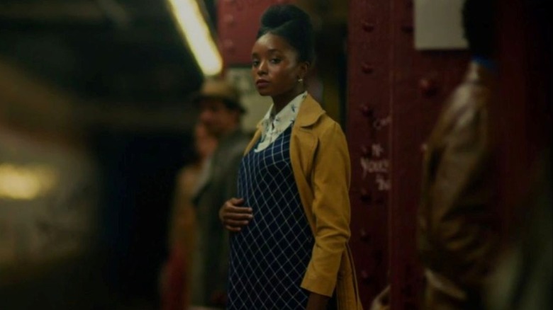 KiKi Layne as Tish Rivers stands pregnant on a subway platform in If Beale Street Could Talk