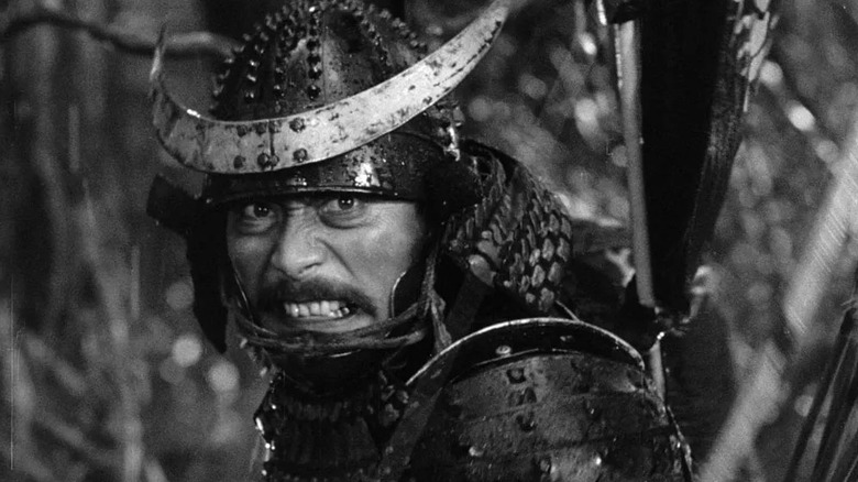 An armored Taketoki Washizu (Toshiro Mifune) grits his teeth in Throne of Blood
