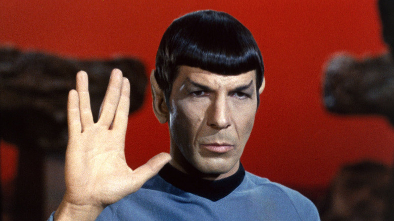 Leonard Nimoy as Spock, making the Vulcan salute in Star Trek.