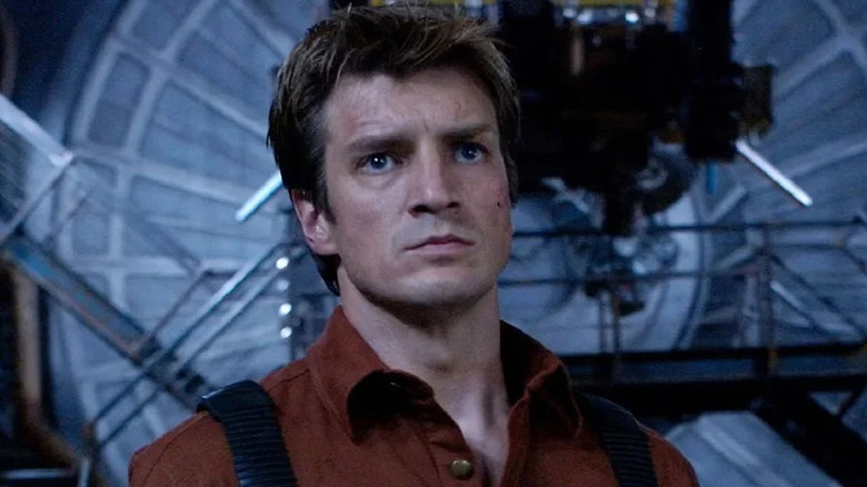 Nathan Fillion as Captain Malcolm Reynolds staring intently in Serenity