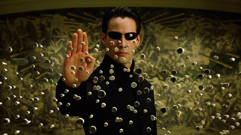 Keanu Reeves as Neo stopping bullets in The Matrix Reloaded