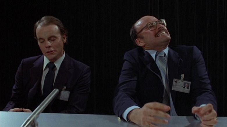 Scanner (Louis Del Grande) suffering from a headache in Scanners