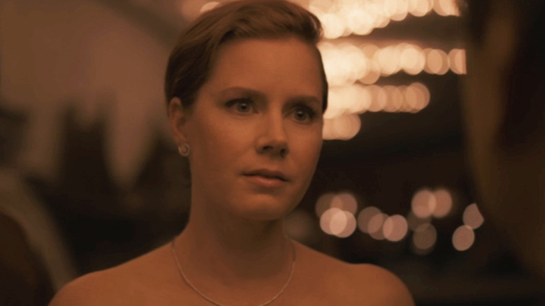 Louise Banks (Amy Adams) stands at a gala in Arrival