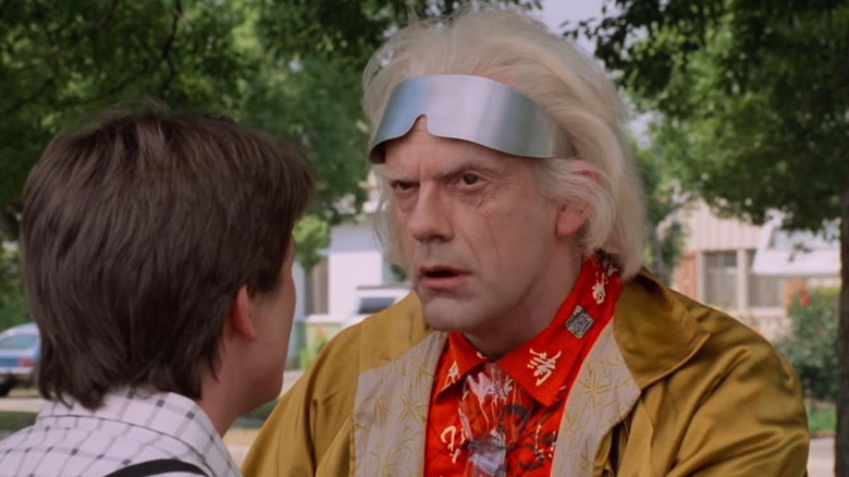 Doc Brown (Christopher Lloyd) ponders for a quick moment while talking to Marty (Michael J. Fox) in Back to the Future
