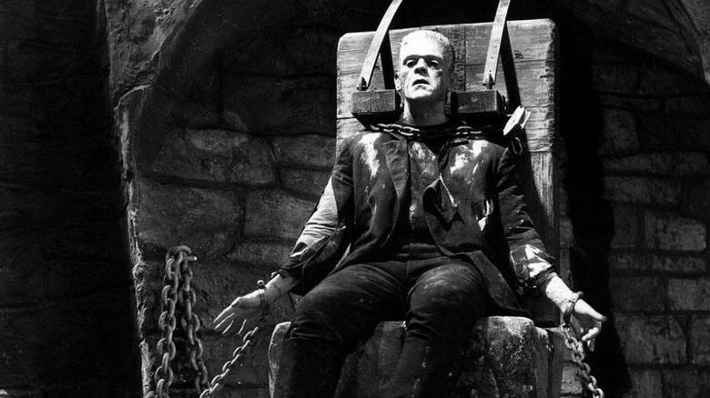 Boris Karloff as the Monster in Frankenstein, chained to a chair.
