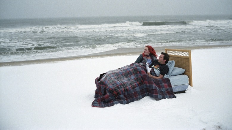 Kate Winslet as Clementine Kruczynski and Jim Carrey as Joel Barish, in a bed on the beach in Eternal Sunshine of the Spotless Mind.
