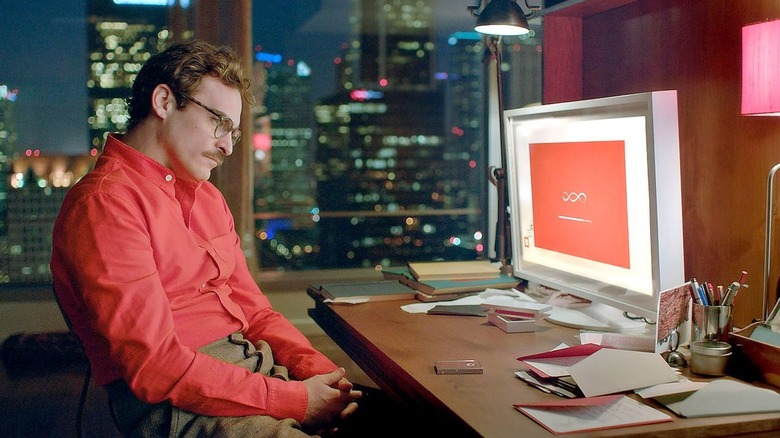 Joaquin Phoenix as Theodore Twombly looks at his computer in Her.