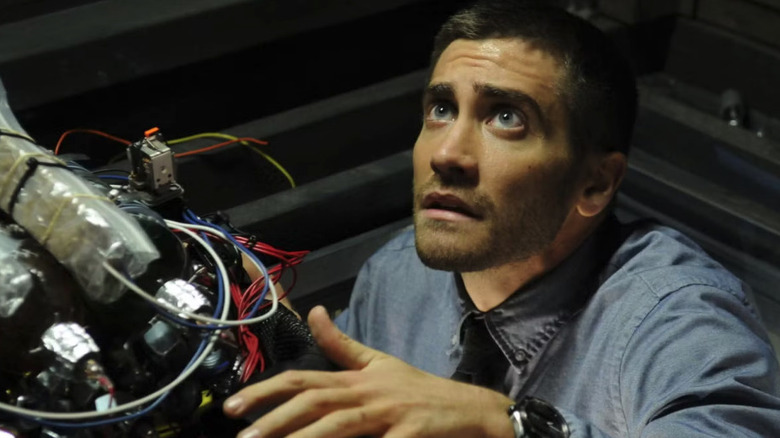 Jake Gyllenhaal as Captain Colter Stevens, trying to disarm a bomb in Source Code.