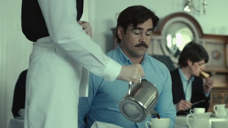 Colin Farrell as David, watching a woman pour his coffee in The Lobster.