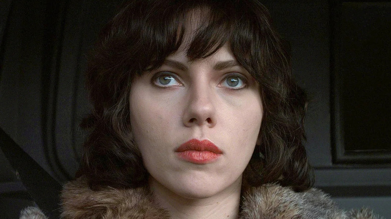 Scarlett Johansson as the Female, looking forward with a blank expression in Under the Skin.