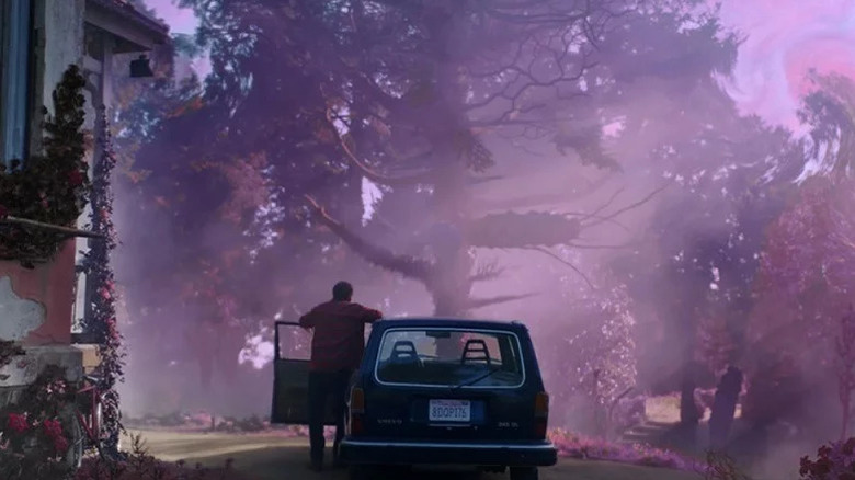 Nathan Gardner (Nicolas Cage) looking at a pink-infused forest in Color Out of Space