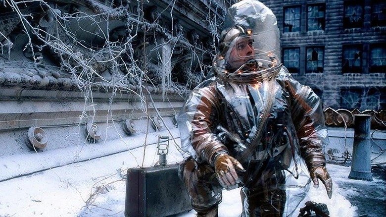 Bruce Willis as James, exploring an apocalyptic surface in 12 Monkeys