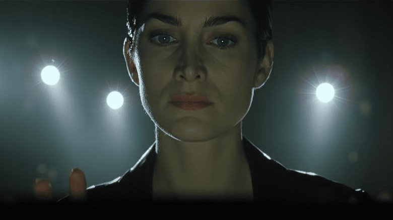 Carrie-Anne Moss as Trinity, at the terminal in The Matrix