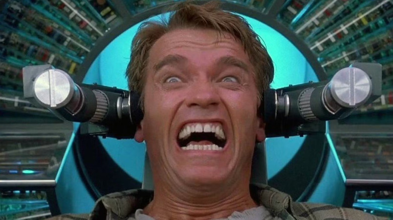 Arnold Schwarzenegger as Quaid, exploring new memories in Total Recall