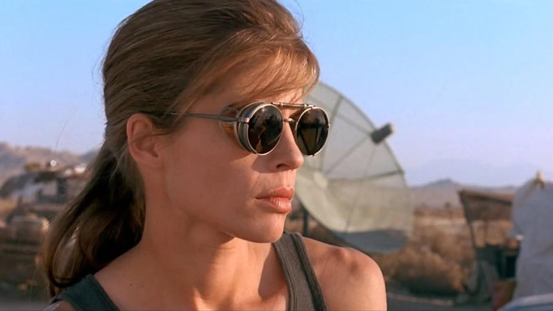 Linda Hamilton as Sarah wearing sunglasses and looking out into the desert in Terminator 2: Judgment Day
