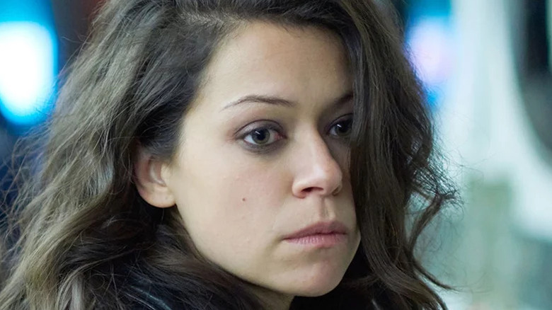 Sarah Manning (Tatiana Maslany) looks to her right with her hair disheveled in Orphan Black