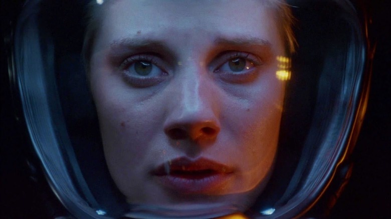 Starbuck (Katee Sackhoff) stares into space from inside her helmet on Battlestar Galactica