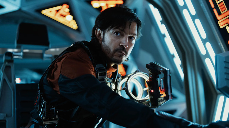 Diego Luna as Cassian Andor, using ship controls in Andor.