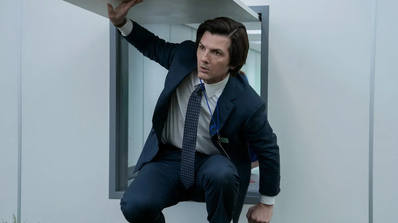 Adam Scott as Mark S., walking through a small door in Severance.
