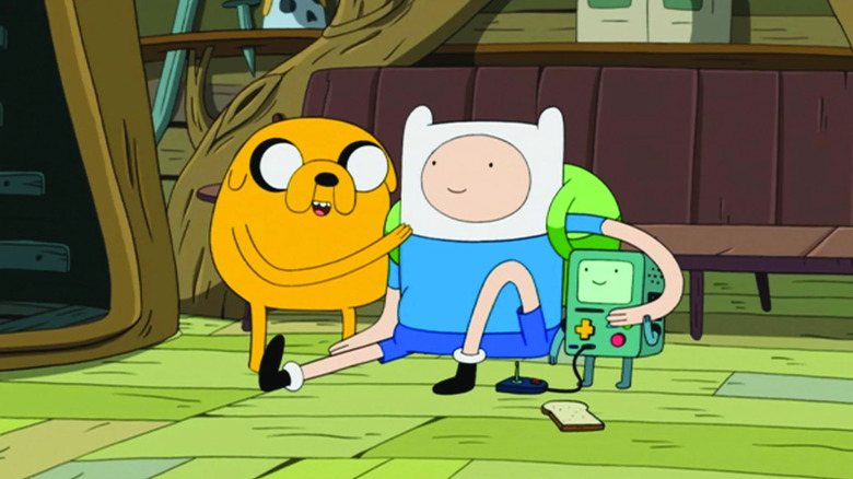 Finn, Jake, and BMO together in the treehouse on Adventure Time