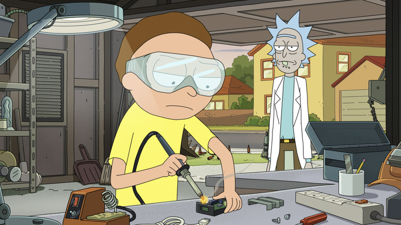 Morty working while Rick watches on Rick and Morty
