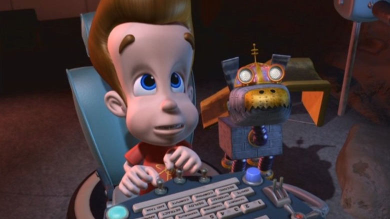 Jimmy Neutron sits in front of control switches while Goddard stands next to him on The Adventures of Jimmy Neutron: Boy Genius