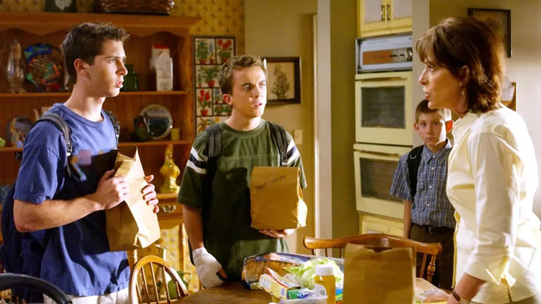 Justin Berfield, Frankie Muniz, Erik Per Sullivan as Reese, Malcolm, and Dewey listen to Jane Kaczmarek as their mother Lois in Malcolm in the Middle