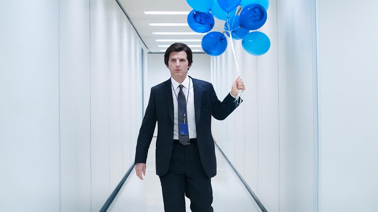 Adam Scott as Mark S., carrying balloons at Lumen in Severance.