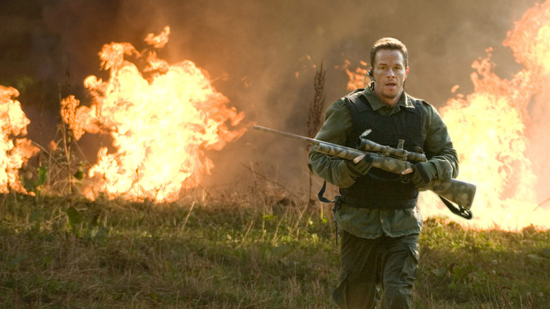Mark Wahlberg as Bob, undeterred by the fire roaring behind him in Shooter