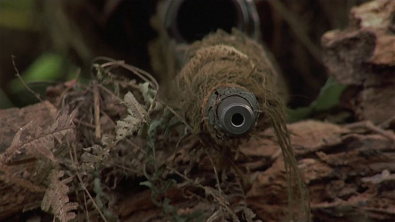 A sniper rifle, prepared to shoot in the woods in Sniper