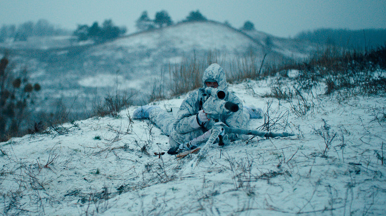 a sniper in winter camo, readying for the shot in Sniper: The White Raven