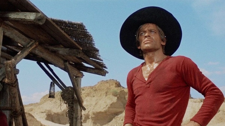 Klaus Kinski as Gary, making a plan in And God Said to Cain