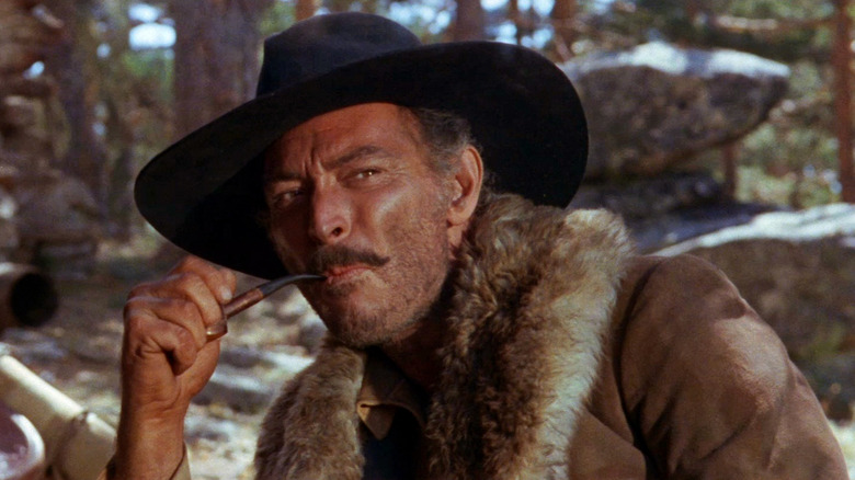 Lee Van Cleef as Corbett, smoking a pipe in The Big Gundown