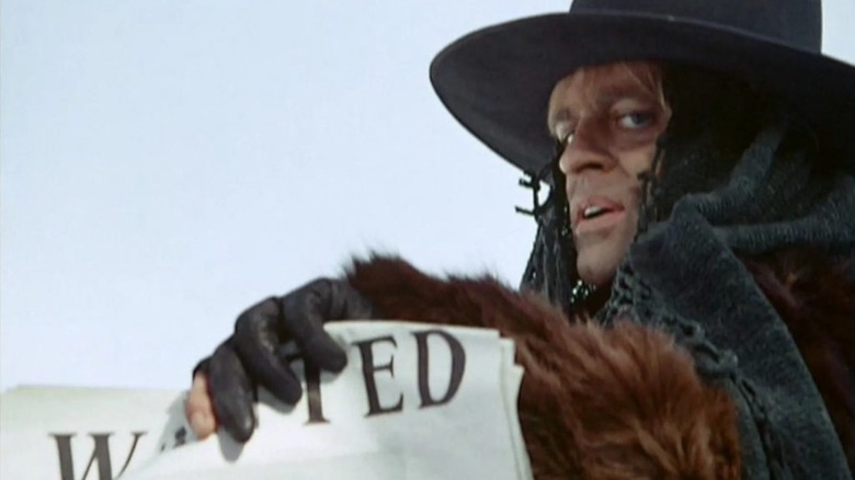 Klaus Kinski as Loco, hunting down a man in The Great Silence