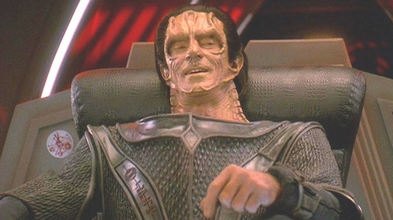 Dukat (Marc Alaimo) sits smugly in a chair in Star Trek: Deep Space Nine