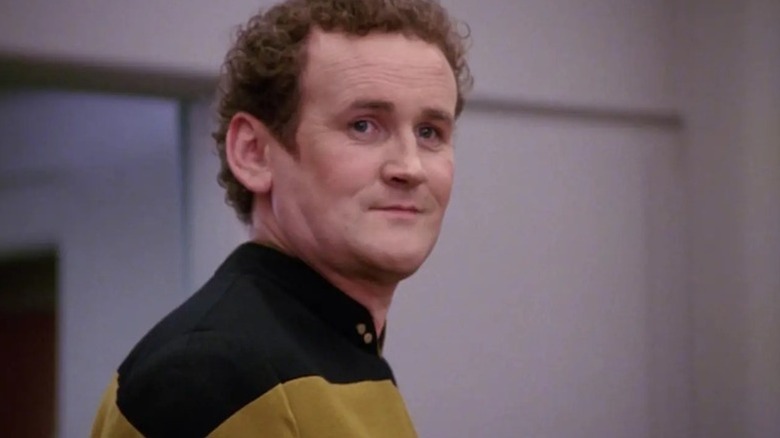 Miles O'Brien (Colm Meaney) stands smiling in Star Trek: The Next Generation